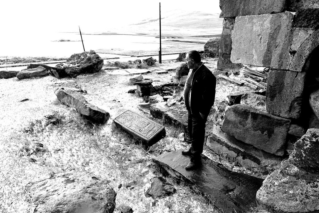 A local Armenian stands amid ruins of an Armenian church in Javakhk (Photo by Aaron Spagnolo, www.AaronSpagnolo.net)