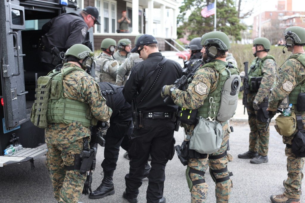 A SWAT team prepares to conduct door to door searches across the street from Baikar Association. (Photo by Nanore Barsoumian, The Armenian Weekly)