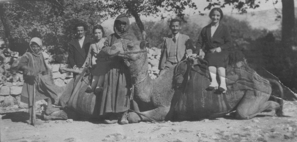 Nevart on a camel with a person identified as Mrs. Manooshag (Armenian teacher)
