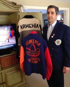 Joe Almasian watches the Winter Olympics’ opening ceremony with the two jackets he wore as Armenia’s first athlete 20 years ago.
