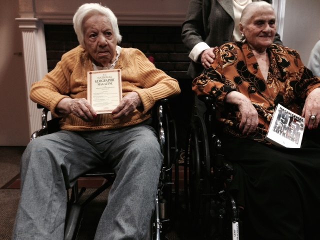 Armenian Genocide survivors Perouz Kalousdian and Azniv Guiragossian, holding copies of ‘The National Geographic Magazine on Armenia and Armenians 1915-1919,’ and Hasan Cemal’s book ‘1915: Armenian Genocide.’