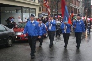 Members of Sam Manoian Post, Armenian-American Veterans of Lowell, make their way along downtown Lowell in the rain, led by Commander Richard Juknavorian. (Tom Vartabedian Photo)