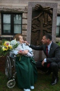 Middlesex County Sheriff Peter Koutoujian embraces 102-year-old Nellie Nazarian by ‘A Mother’s Hands’ Genocide Memorial after unveiling. Nellie is the lone remaining genocide survivor in Merrimack Valley. (Tom Vartabedian Photo)