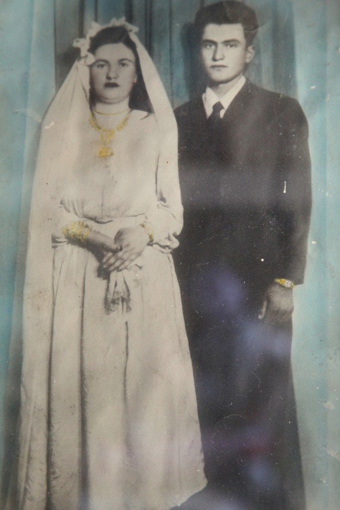 A photograph of Baydzar and Sarkis on their wedding day hangs on the wall of their apartment (photo by Nanore Barsoumian)
