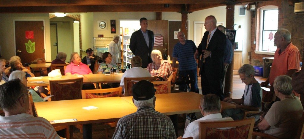 Middlesex County Sheriff Peter Koutoujian announced his endorsement of Warren Tolman for attorney general as the two spoke with seniors in Waltham in July. (Courtesy of the Warren Tolman for Attorney General campaign)