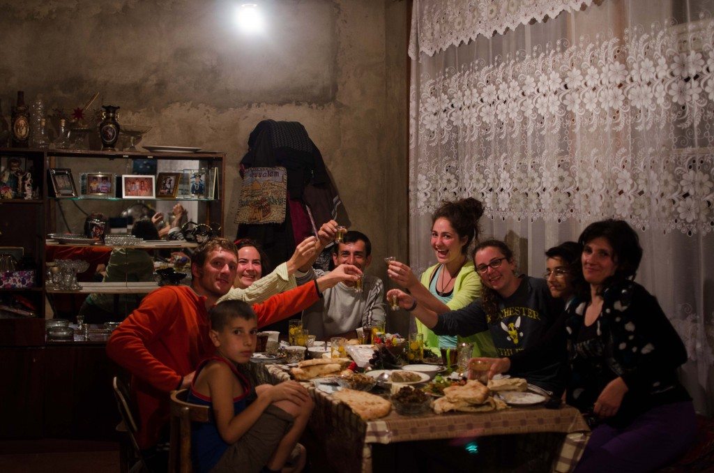 Our team toasts to family and friendship with our generous hosts in Azokh.