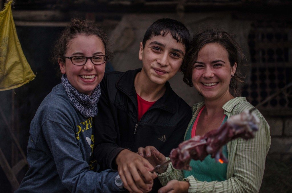Ali Hamlin and Elizabeth McFadden help prepare khorovats in Patara after a long day on the trail.