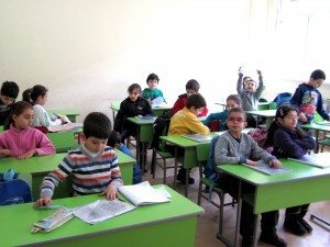 Syrian Armenian children getting ready for class after recess at the Giligian School in Yerecan in 2013 (Photo by Khatchig Mouradian)