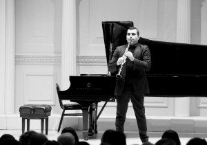 Narek Arutyunian plays his clarinet in front of the crowd that gathered for the 7th annual NYSEC concert.