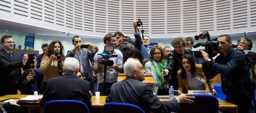 Perincek is greeted by members of the media (Photo: EAFJD)