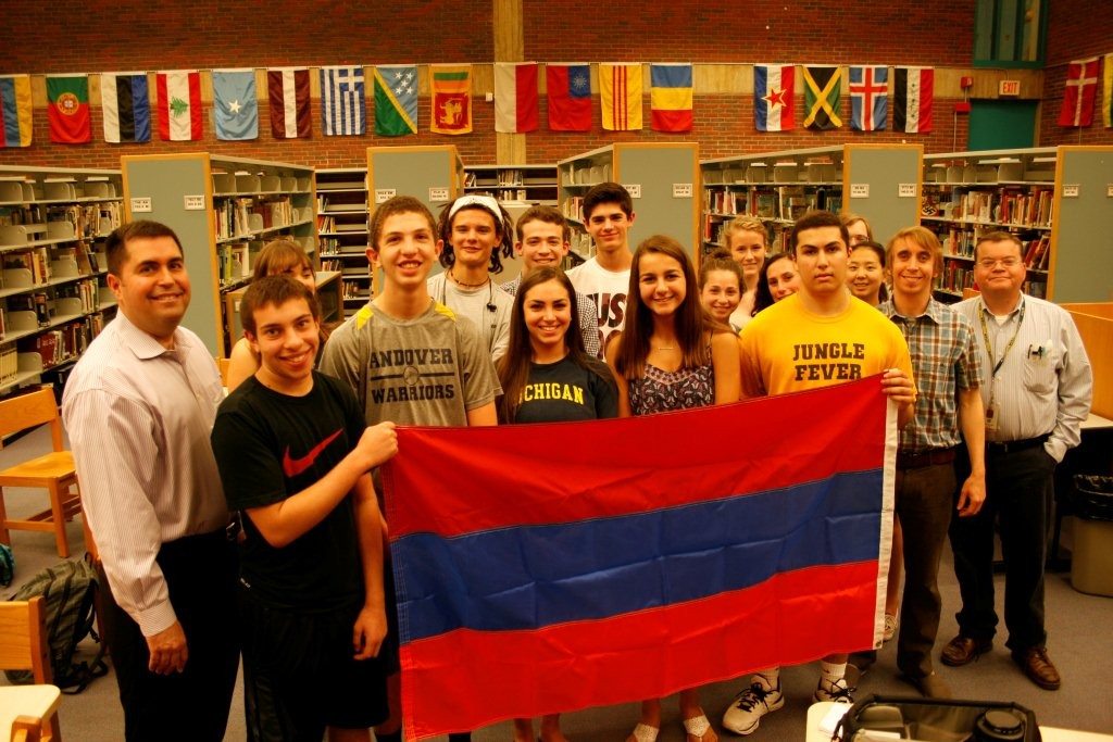 Armenian students at Andover High School donated an Armenian flag and collection of books in commemoration of the Genocide Centennial. Taking part were (front, L-R) Dro Kanayan, chairman of the Armenian Genocide Commemorative Committee of Merrimack Valley, Michael Mahlebjian, Richard and Ani Minasian, Anna Shahtanian, Chris Berberian, Brendan Gibson, social studies teacher, and John Berube, library media specialist.