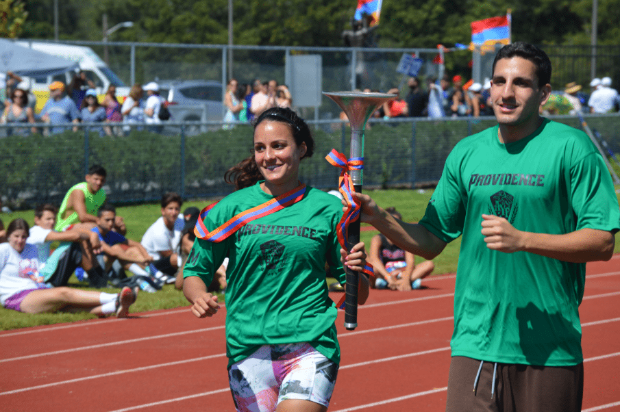 Lynne and Stephen Tutunjian Carry In the Olympics Torch