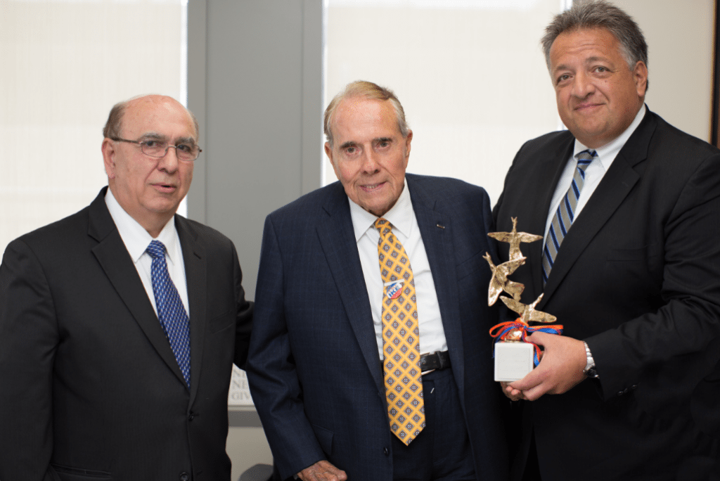 Senator Bob Dole receives the Survivor's Gratitude Award from NCAGC Steering Committee Chairman Noubar Afeyan