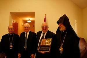 Attorney Gregory Arabian (with plaque) was recognized for his $67,000 gift, which enabled a handicapped lift at St. Gregory Church in memory of his parents. He is joined by brother Jack, Archbishop Oshagan Choloyan, and Der Stephan Baljian. (Photo: Tom Vartabedian)