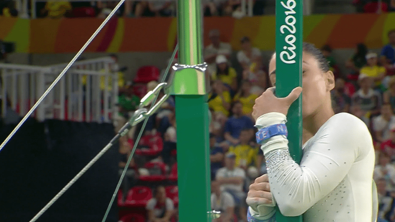 Gebeshian finished her routine by kissing the uneven bars.