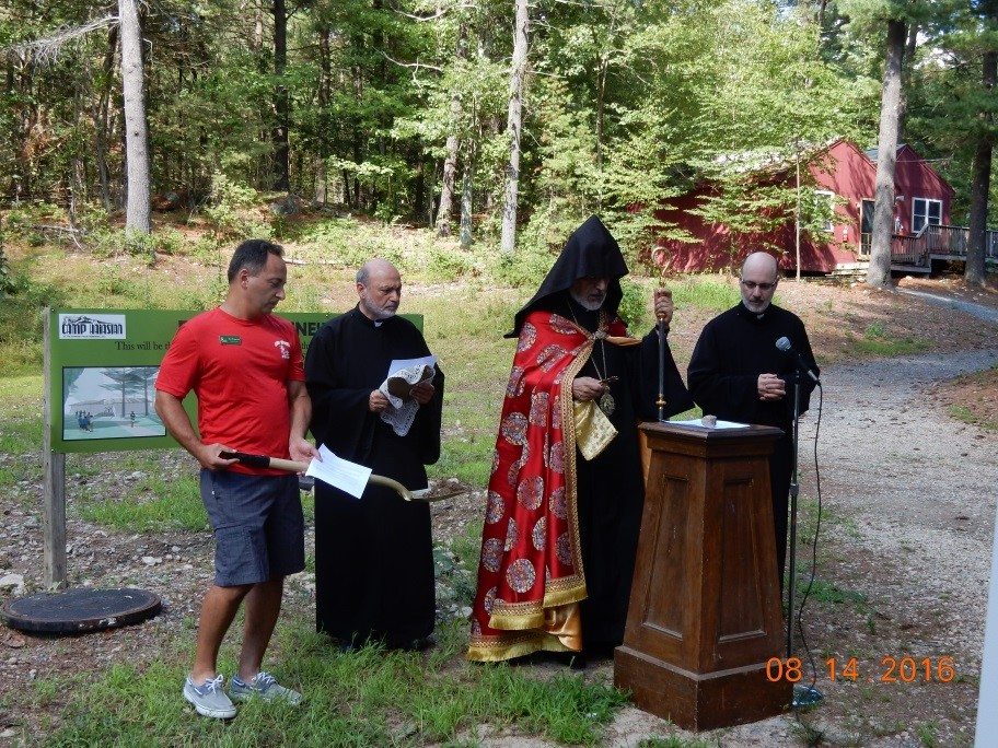 Surpazan Oshagan Choloyan officiates the blessing of the ground with assistance from Der Gomidas Baghsarian and Der Kapriel Nazarian of Sts. Executive Director David Hamparian is holding a ceremonial shovel with dirt from the site.