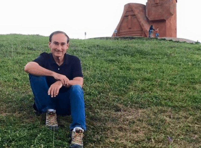 Bohjalian and the 'We Are Our Mountains' monument in Stepanakert, NKR (Photo: Knar Babayan)