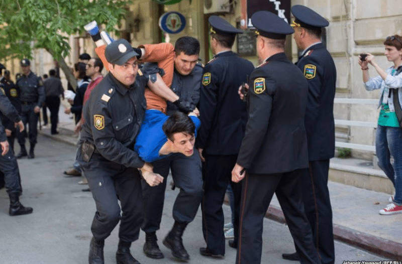 A man being arrested in Azerbaijan. (Photo: Global Voices Advocacy)