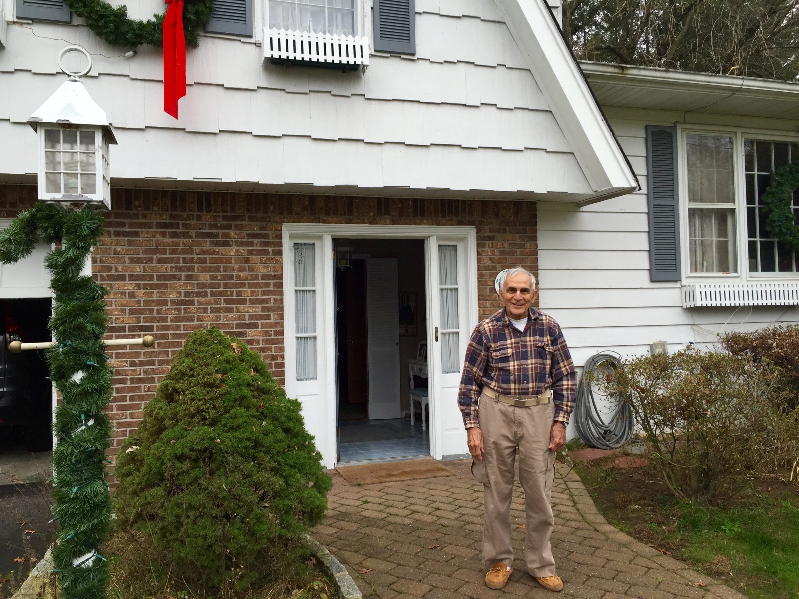 Grampie in front of his home