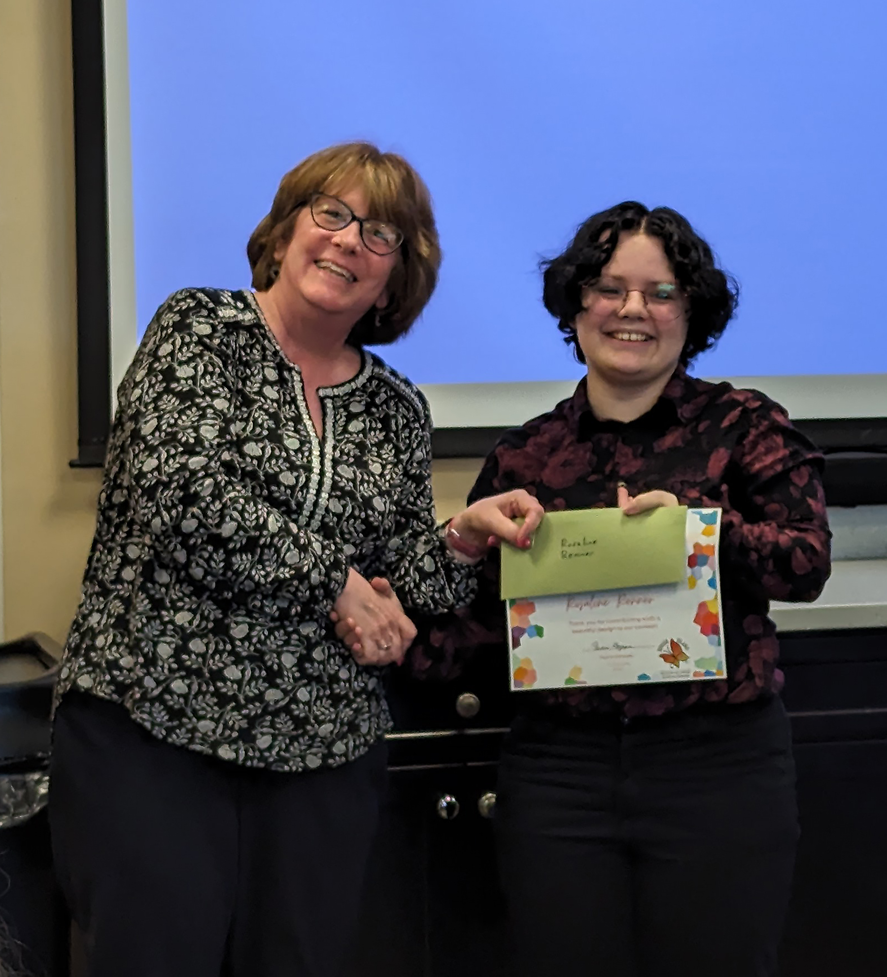 Logo contest runner-up Rosaline Renner with RIHGEC vice-chair Anne ...