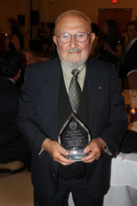 Tatul Sonentz-Papazian holds the E. Agnouni Award